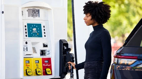 Woman fueling her car at a Speed station pump